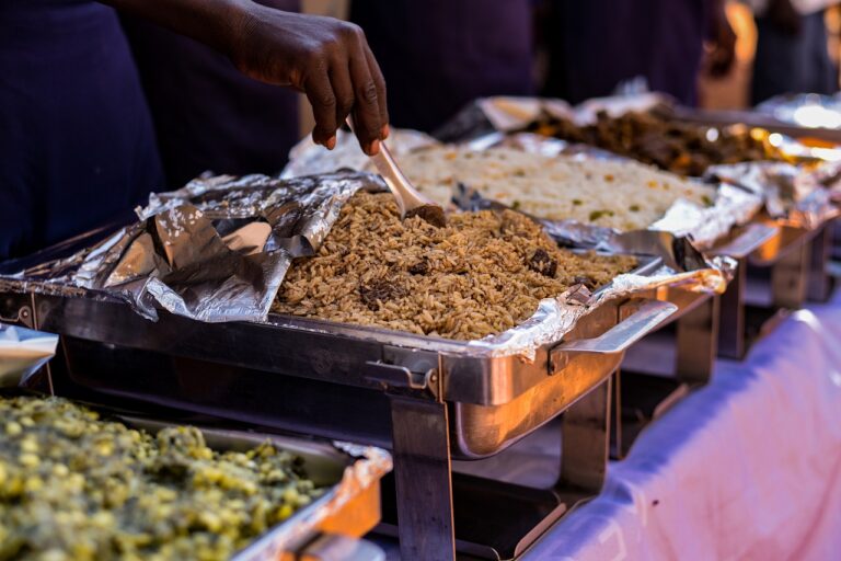 a table setup in a buffet style with different meals displayed like rice and salad